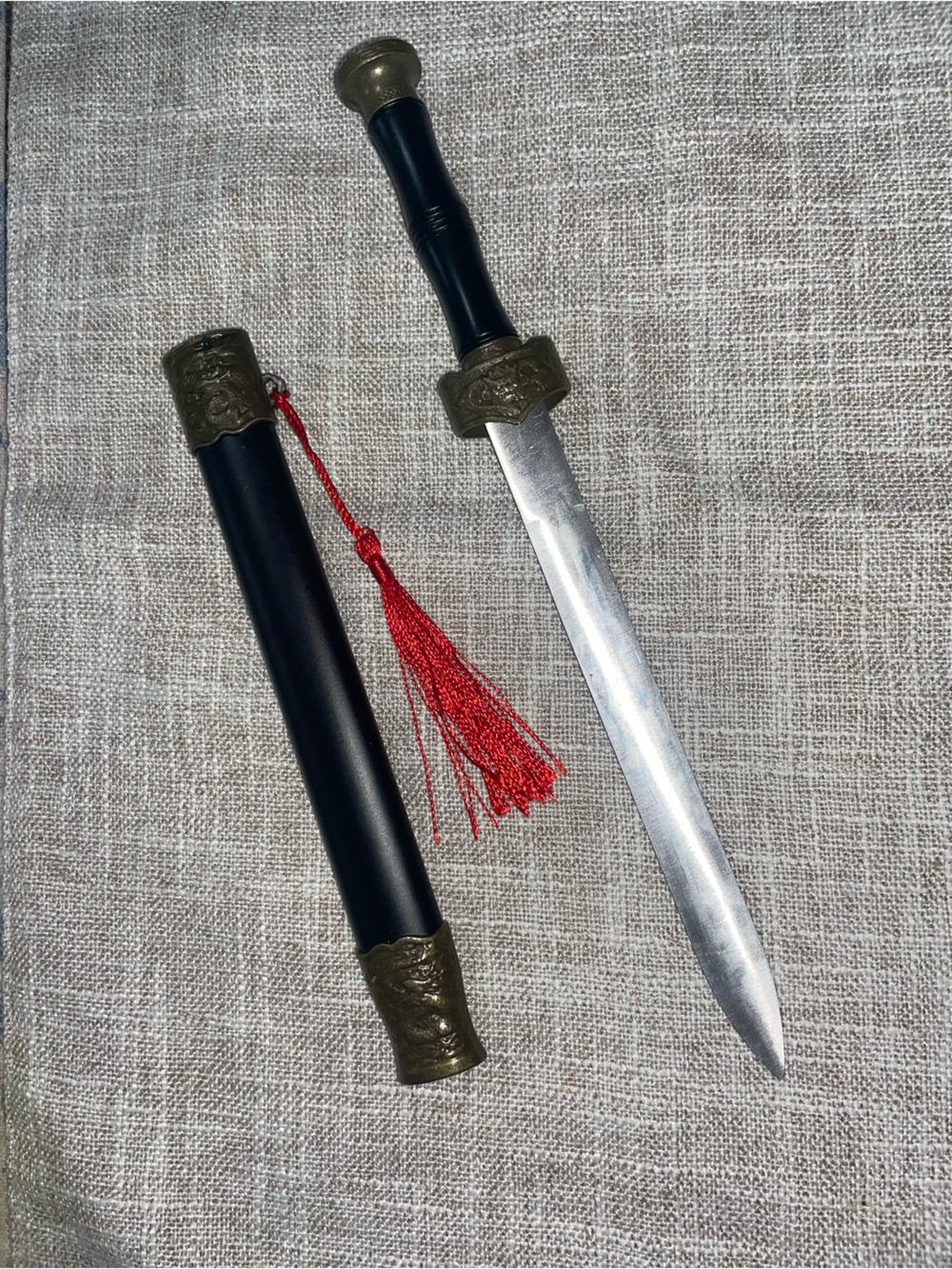 Decorative Black and Brass Letter Opener with Red Tassel